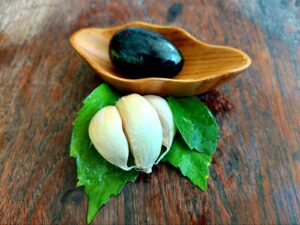 Black yoni egg in a bowl